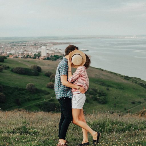 photo-of-woman-and-man-hugging-while-standing-on-grass-1391480